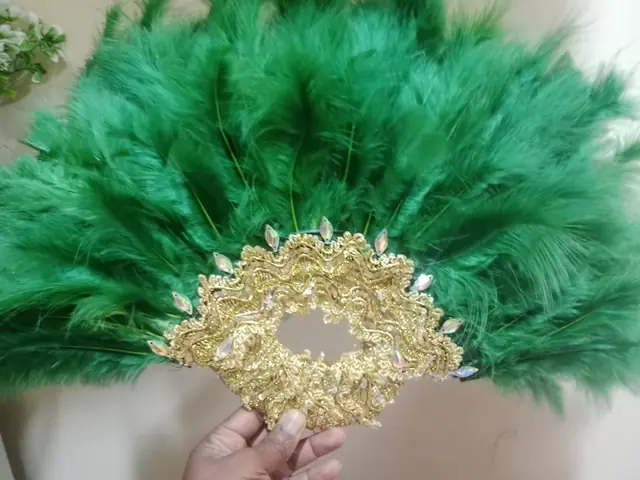 Green feather hand fan with gold lace detail