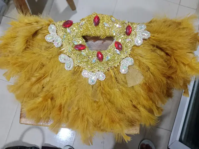 Mustard feather hand fan with jewelled brooch