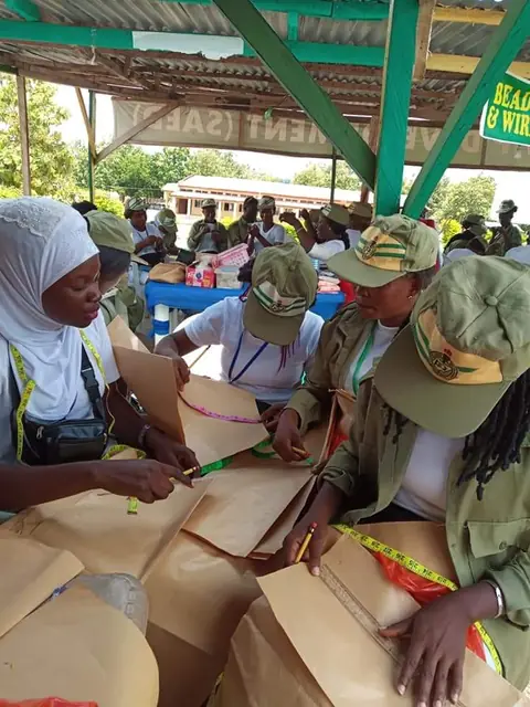 Corps members working on practical tasks