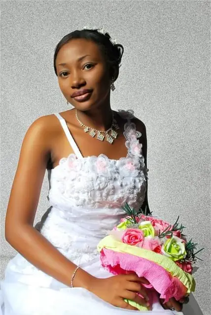 Bride in a sweetheart gown with a pink bouquet