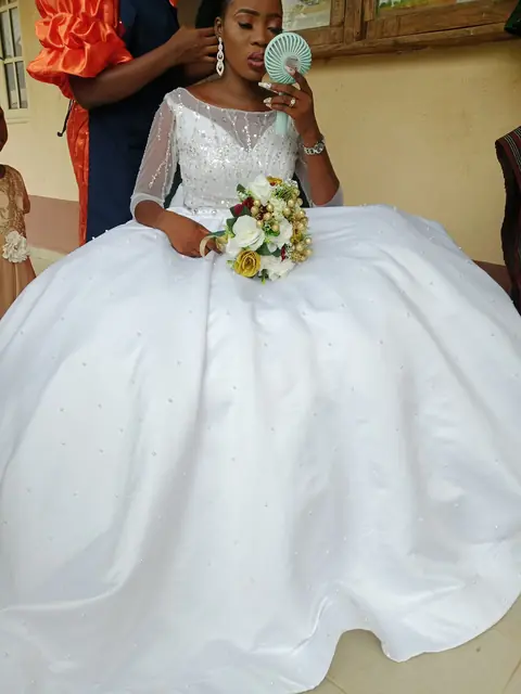 Bride in a ball gown with a cream bouquet